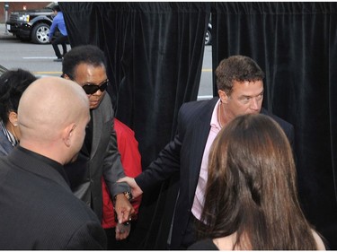 Boxing legend Muhammad Ali arrives at District 319 in downtown Vancouver Thursday October 8, 2009 for the screening of a VIFF movie about his life Facing Ali.