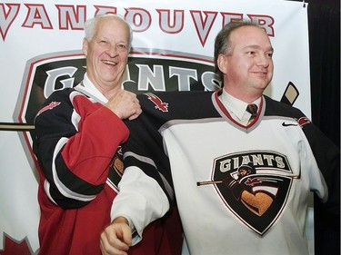The jersey of the Vancouver Giants WHL team is modelled by Gordie Howe (left) and Ron Toigo at the unveiling today. The league has it's first game in Vancouver in September, 2001.