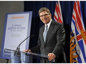 Geoffrey Cowper following the release of his 175-page report on the state of B.C.'s legal system on August 30, 2012.
