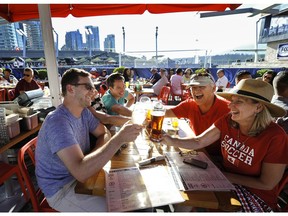 Customers enjoy a beer with a view at the Tap & Barrel's Convention Centre location.