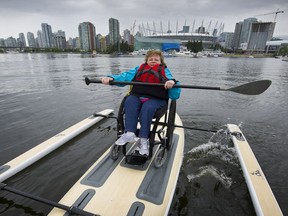 Taking it to the water: Crystal Carroll gets set to take to the waters of False Creek with the Onit Ability Board. The new wheelchair paddling program has launched in Vancouver, allowing those who are bound to wheelchairs to experience Vancouver from the water.