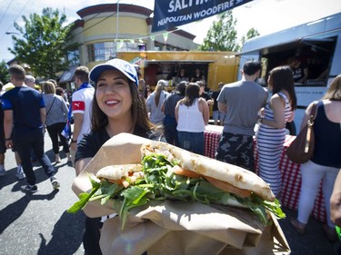 Italian Day on Vancouver's  Commercial Drive on June 12, 2016. Cristina Delli Santi shows off a traditional wood-fired Saltimboca.