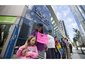 Members of the local Muslim community joined with the gay community to protest outside of the new Trump tower in downtown Vancouver on Sunday. Mark van Manen/PNG