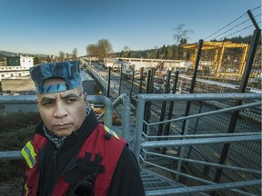 Julio Serrano at the Evergreen Line Skytrain in Port Moody. He used to operate the yellow crane at right.