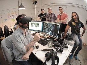Tyler McCulloch (headset), Cory Hawthorne, Alan Jernigan, Derek Young and DinosTsiknis, of Vancouver game developer Charm Games, working on a new virtual reality game named FORM, in Vancouver, BC., June 13, 2016.