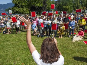 Protesters rally at Kits Beach in Vancouver on Sunday to voice their concerns about how city hall isn't consulting them about changes to their neighbourhood. Ric Ernst/PNG