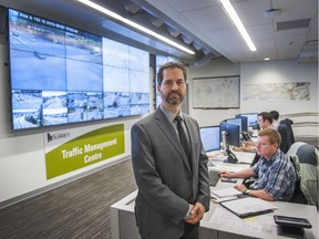 Surrey's manager of transportation Jaime Boan stands in the central control room at city hall.