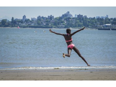 Cynthia Ouchi runs along Spanish Banks beach in Vancouver, B.C., Sunday, June 5, 2016.