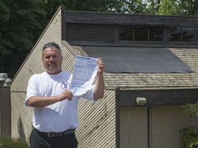 Rick Evon with his tax bill in Port Moody.