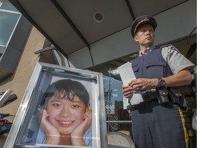 RCMP Cpl Jamie Chung stands beside portrait of Annie Leung. A 75-year-old man has been sentenced to four months in jail for a hit-and-run crash that killed the teenage girl from Port Coquitlam.