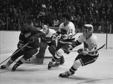 Vancouver Canucks vs. Detroit Red Wings at the Coliseum on November 17, 1970. Gordie Howe (left) and Canucks' Dale Tallon #19.