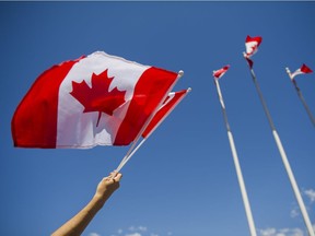 VANCOUVER. July 01 2015. Brendan Griffiths sells Canadian Flags for Canada Day at Canada Place, Vancouver, July 01 2015. Gerry Kahrmann  /  PNG staff photo) ( For Prov / Sun News ) 00037679A [PNG Merlin Archive]