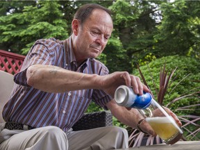 One who remembers the old days, retired Liquor Distribution Branch employee Leo Hillairet pours a beer in his backyard in Langley. Gerry Kahrmann/PNG