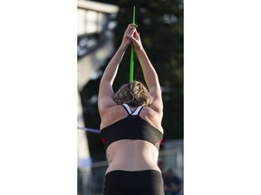 Liz Gleadle stretches before throwing a javelin at the Vancouver Sun Harry Jerome International Track Classic at Swanguard stadium.