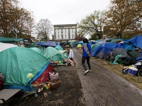 File: Resident "Annie" walks through Tent City in VICTORIA, B.C. April 5, 2016.