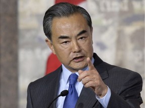 China's Minister of Foreign Affairs Wang Yi responds to a Canadian journalist's question during a press conference with Canadian Minister of Foreign Affairs Stephane Dion (not shown) on Wednesday, June 1, 2016 in Ottawa.