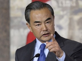 China's Minister of Foreign Affairs Wang Yi responds to a Canadian journalist's question during a press conference with Canadian Minister of Foreign Affairs Stephane Dion on June 1.