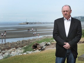 Council critic Dennis Lypka is pictured on White Rock's East Beach, where council plans a $30-million seaside walkway and amenities.