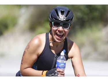 American Jacqueline Hernandez smiles after making it to the top of the course's toughest climb at the 2016 Ironman Canada in Whistler, B.C.