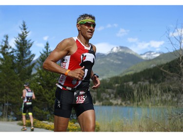 Vincenzo Cavaliere runs past Green Lake at the 2016 Ironman Canada in Whistler, B.C.
