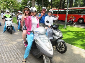Tom and Sharon Jamieson prepare for their motorbike tour of Ho Chi Minh City.