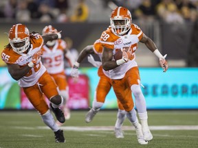 BC Lions' Anthony Thompson returns a fumble against the Hamilton Tiger Cats in during CFL football action at Tim Hortons Field in Hamilton on Friday July 1, 2016.