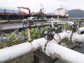 A ship receives its load of oil from the Kinder Morgan Trans Mountain Westridge loading dock in Burnaby.