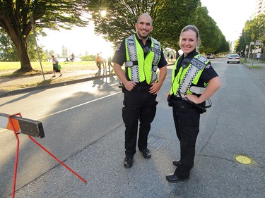 Two of Vancouver's finest Cst. Brandon Ross and Cst Mariya Zhalovaga help ensure that vehicle traffic stays out of the west end prior to the first night of The Celebration of Light.  Rob Kruyt Photo