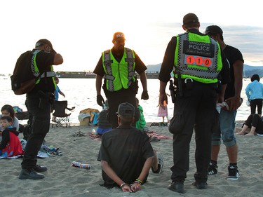 Police made at least one arrest while waiting for the start of The Celebration of Light.  Rob Kruyt Photo