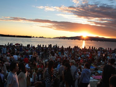 The crowd builds while the sun sets over Bowen Island, waiting for The Celebration of Light.  Rob Kruyt Photo
