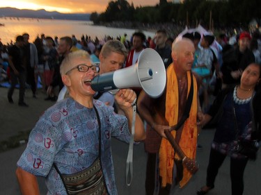 Hare Krishna follows chant out a rythm while waiting for the start of The Celebration of Light.  Rob Kruyt Photo