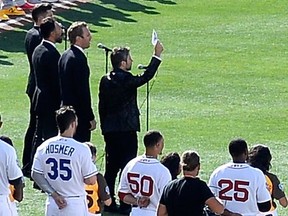Remigio Pereira holds up a sign saying "All Lives Matter" during The Tenors' rendition of O Canada before the MLB All-Star Game at PETCO Park in San Diego. Pereira will not perform again with the group "until further notice".