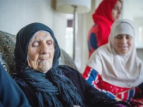 Amona Ali sits with her granddaughter Khadiga el Ebrahim at a hotel in Surrey. The refugee family fled Syria and are being temporarily housed in Surrey.