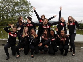 Women's Sevens Rugby Canada officially announced the 12 athletes nominated to compete at the Rio 2016 Olympic Games, front row, from left to right, Ghislaine Landry, Kayla Moleschi, Ashley Steacy, Bianca Farella, Charity Williams and Megan Lukan. Back row, from left to right, Natasha Watcham-Roy, Britt Benn, Hannah Darling, Kelly Russell, Jen Kish, and Karen Paquin, pose for a photo before the start of a press conference at the Inn at Laurel Point in Victoria, B.C., Friday, July 8, 2016.