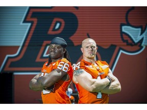Solomon Elimimian (left) and Adam Bighill were huge on Friday for the B.C. Lions as the linebackers and their defensive brethren held the Hamilton Tiger-Cats at bay in a 28-3 win.