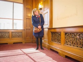 Barbara Bell admires some of the art deco panels originally from the Georgia Medical Dental Building.