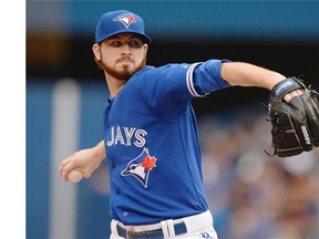 Blue Jays pitcher Drew Hutchison escaped injury Sunday when he was struck in the back of the head by catcher A.J. Jimenez's throw to second base on an attempted stolen base during the fifth inning of a 7-3 victory over the Tampa Bay Rays.