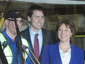 Prime Minister Justin Trudeau with B.C. Premier Christy Clark and Vancouver Mayor at Sky Train Operations and Maintenance Centre, in Burnaby on June 15, 2016.