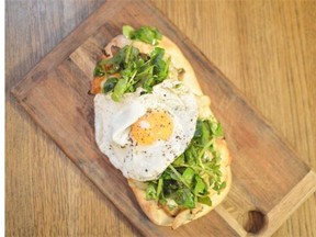 Cafe Medina chef Deniz Tarakcioglu’s Coca flatbread with sautéed mushrooms, greens and egg.