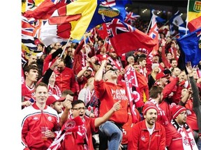 Canada fans celebrate after beating Honduras at BC Place Stadium in Vancouver last November.