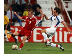 A young Iain Hume (L) reaches the ball before Czech Republic's Tomas Sivok during their FIFA World Youth Championship Group C match in Dubai in 2003. Canada won 1-0. (AFP PHOTO/MOHAMMED MAHJOUB)