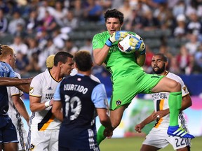 Los Angeles Galaxy goalkeeper Brian Rowe (12) makes a save in the first half of the game against the Vancouver Whitecaps at StubHub Center.