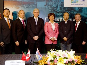 Close ties: There are strong links between Premier Christy Clark's Liberal party and RCI Capital Group's boss John Park. Here is Clark announcing a memorandum of understanding between RCI Capital Group and a potential Chinese investor during her 2013 trip to China, South Korea and Japan. From left to right: RCI's China-based managing director Larry Liang, RCI lead director Stockwell Day, Canadian Ambassador to China Guy Saint-Jacques, Clark, China New Energy Chamber of Commerce vice-chairman Hong Hao, and B.C.'s special representative in Asia Ben Stewart.