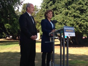 Premier Christy Clark and Finance Minister Mike de Jong announce a foreign buyers tax on Metro Vancouver real estate at the legislature in Victoria on July 25.