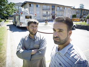 Bilal Al Falovji, left, and Mohammad Alradi are among about 50 Syrian refugees left homeless after an apartment fire Thursday in the 500 block Cottonwood Avenue in Coquitlam. Mark van Manen/PNG