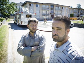 Bilal Al-Falovji, left, and Mohammad Alradi were two of the refugees left homeless by the fire on Thursday.