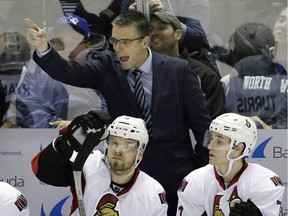 FILE - In this Jan. 18, 2016 file photo, Ottawa Senators head coach Dave Cameron, top, yells out instructions.