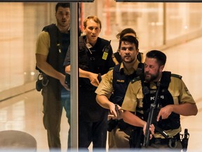 Police officers respond to a shooting at the Olympia Einkaufzentrum (OEZ) at July 22, 2016 in Munich, Germany.  According to reports, several people have been killed and an unknown number injured in a shooting at a shopping centre in the north-western Moosach district in Munich. Police are hunting the attacker or attackers who are thought to be still at large.
