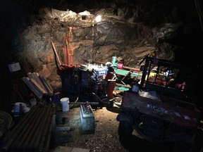 Drillers Eric Rollin and Jeremy Fisher, with the firm Morecore Drilling, prepare to probe the rock of Red Mountain as part of Vancouver-based IDM Mining's underground exploration program within its claim on the mountain.
