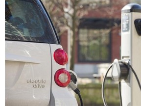 An electric car  ( EV ) uses a public charging station, 959 Mainland Street  Vancouver February 23 2016.